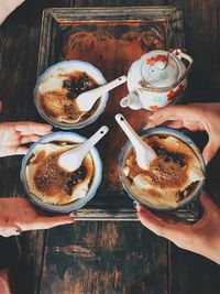 Cropped hands of people with dessert