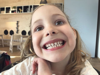 Close-up portrait of smiling girl