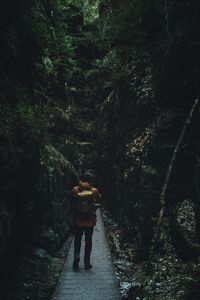 Woman walking in forest