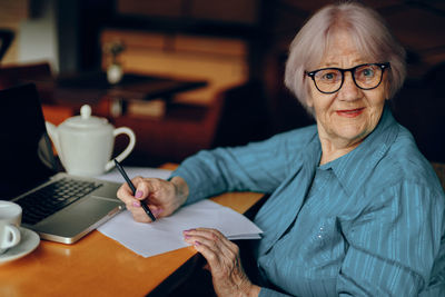 Portrait of senior woman wearing eyeglasses