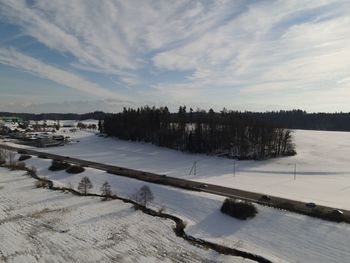 Scenic view of frozen lake against sky