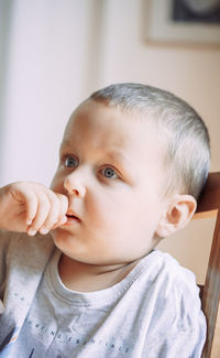 Close-up of cute baby boy at home