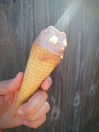 Close-up of hand holding ice cream