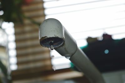 Close-up of water drop on metal