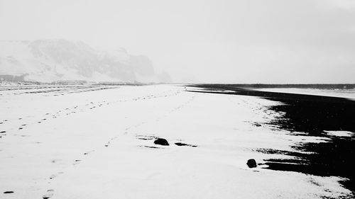 Scenic view of sea against sky during winter