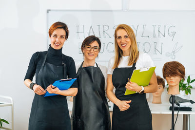 Professional hairdresser with students