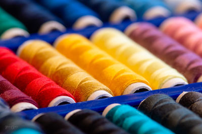 Close-up of colorful thread spools