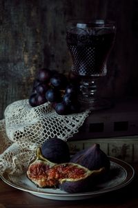 Close-up of grapes in plate on table