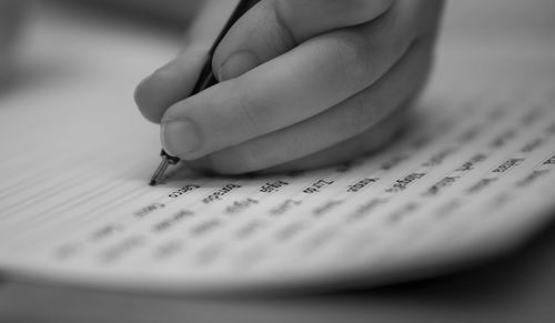 Close-up of hand holding book