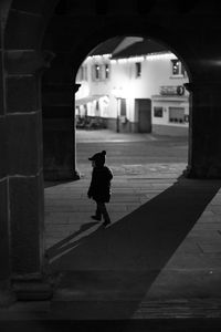 Silhouette kid walking in building