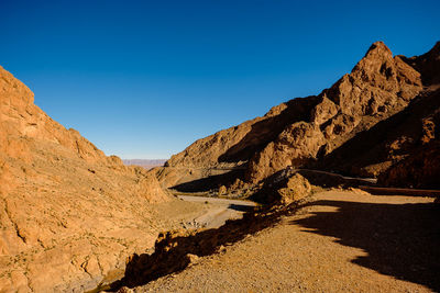 Scenic view of mountains against clear blue sky