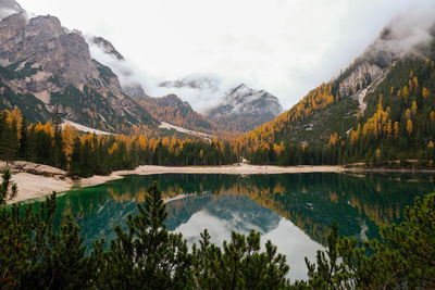 Scenic view of lake and mountains against sky