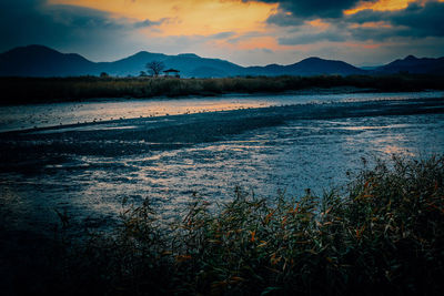 View of lake at sunset