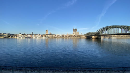 Bridge over river with buildings in background