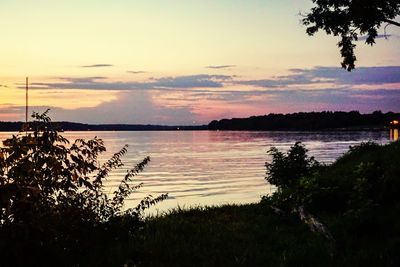 Scenic view of lake against sky during sunset