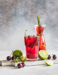 Lemonade or non-alcohol cocktail with cherry and lime. summer refreshment drink.