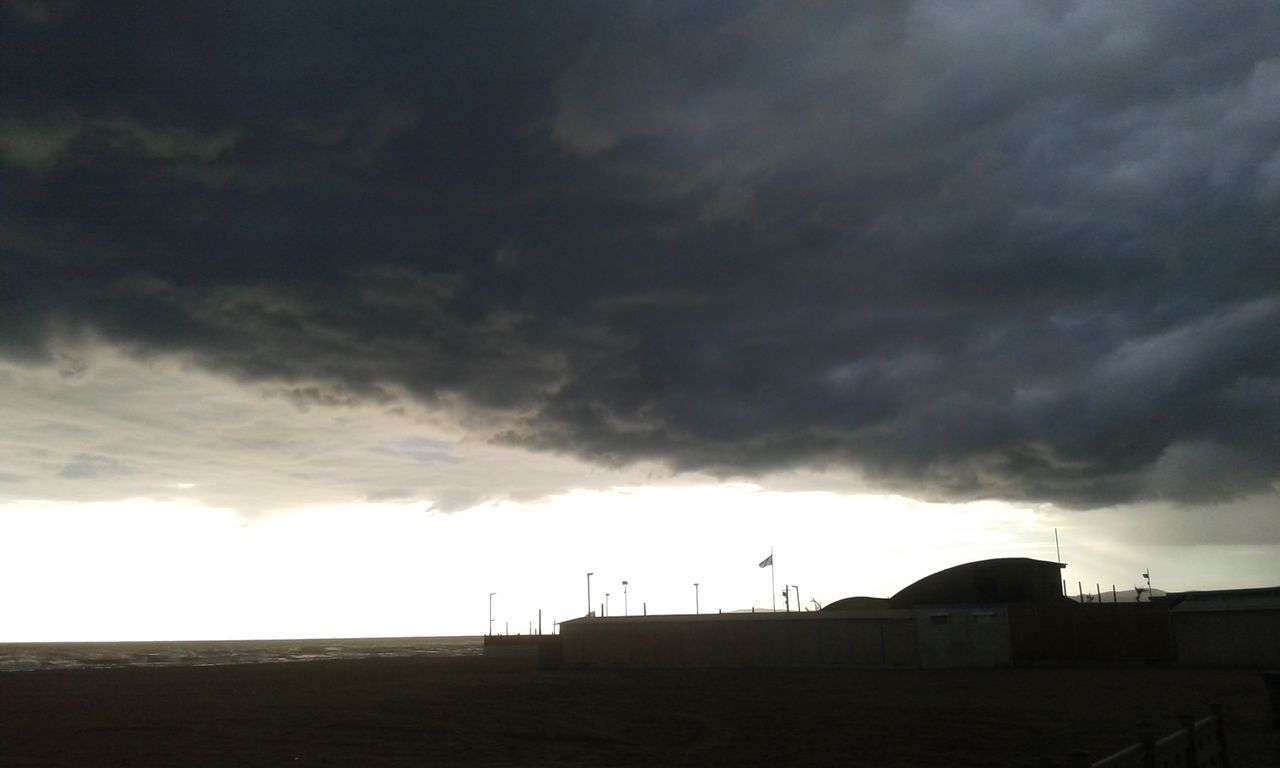 sky, cloud - sky, cloudy, silhouette, weather, overcast, sunset, storm cloud, built structure, cloud, scenics, landscape, dramatic sky, building exterior, dusk, beauty in nature, tranquil scene, nature, architecture, tranquility