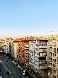 Buildings in city against clear sky