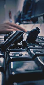 Close-up of wireless earphones on keyboard