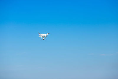 Low angle view of airplane flying in sky