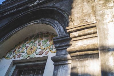 Low angle view of statue against building