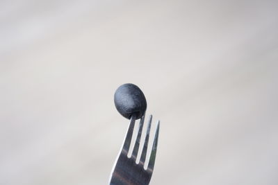 Close-up of metallic structure against white background