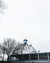 Low angle view of bridge and building against sky