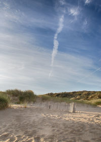 Scenic view of beach against sky