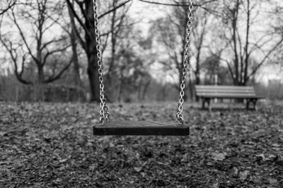 Close-up of empty swing in park