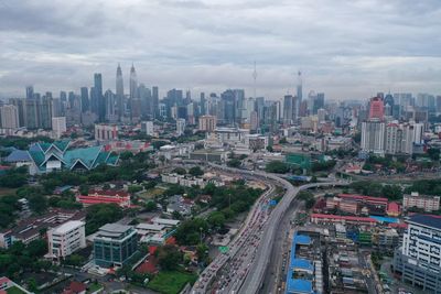 High angle view of buildings in city against sky