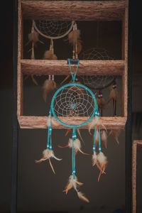 Close-up of dragon hanging on wood