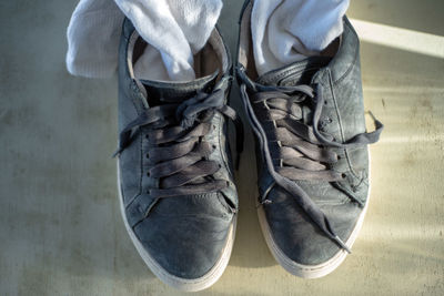 Low section of man standing on floor