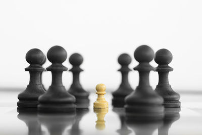 Close-up of chess board against white background