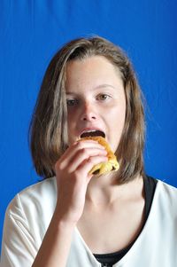 Portrait of woman eating food