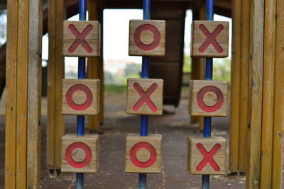 Close-up of information sign on wood