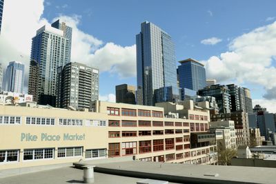 Modern buildings in city against sky