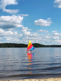 Sailboat on sea against sky