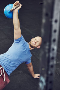 Man training in gym with kettlebell