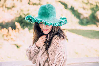 Portrait of young woman in hat