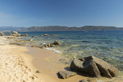 Scenic view of sea against blue sky