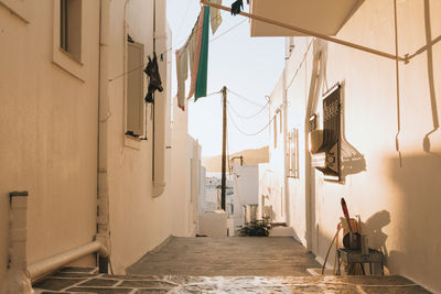 Clothes drying in alley amidst houses