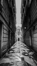 Narrow alley amidst buildings in city