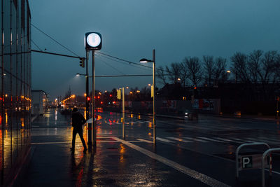 View of wet road at night