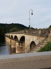 Bridge over river against sky