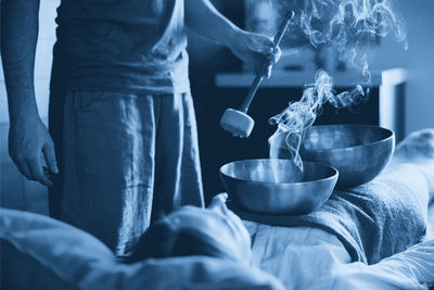 Midsection of man preparing food