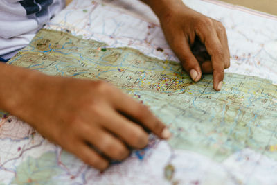 Cropped hands of man with map