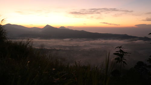 Scenic view of mountains against sky during sunset