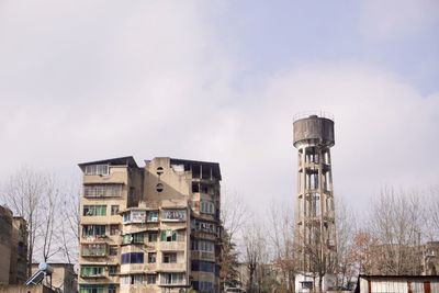 Low angle view of water tower against sky