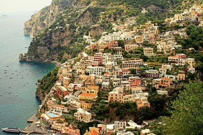 High angle view of townscape by sea