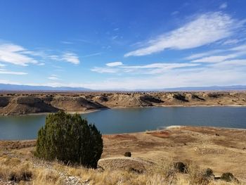 Scenic view of sea against blue sky